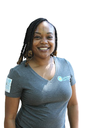 A woman with dreadlocks wearing a gray shirt.