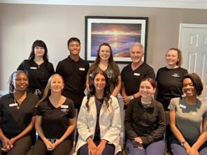 Chiropractor at Charleston Pain Relief Center helping patient with back adjustment in North Charleston SC