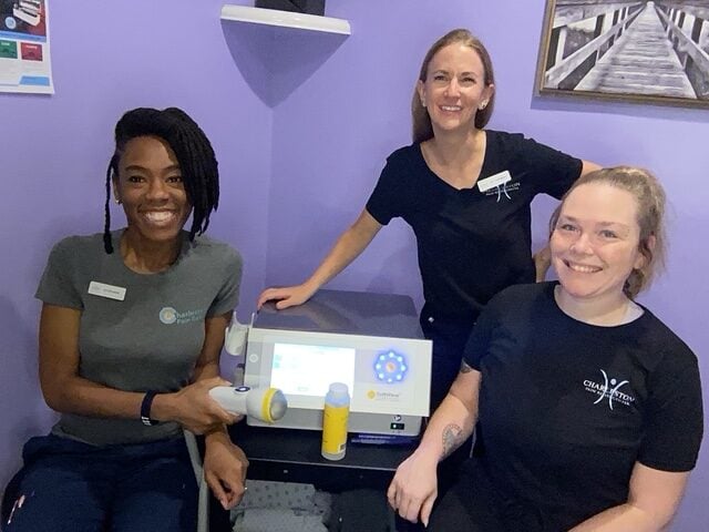 The Charleston Pain Relief Center SoftWave therapy team with the SoftWave device in North Charleston, SC