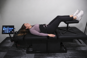 Patient receiving spinal decompression therapy for symptoms related to a herniated disc